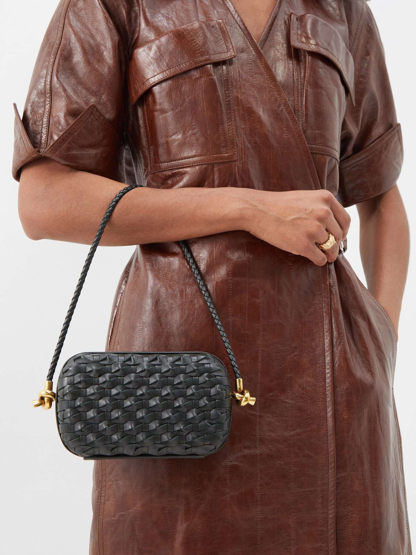 Knot padded intrecciato leather clutch