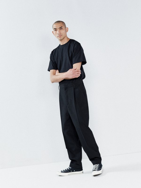 Raey Exaggerated tapered-leg wool trousers