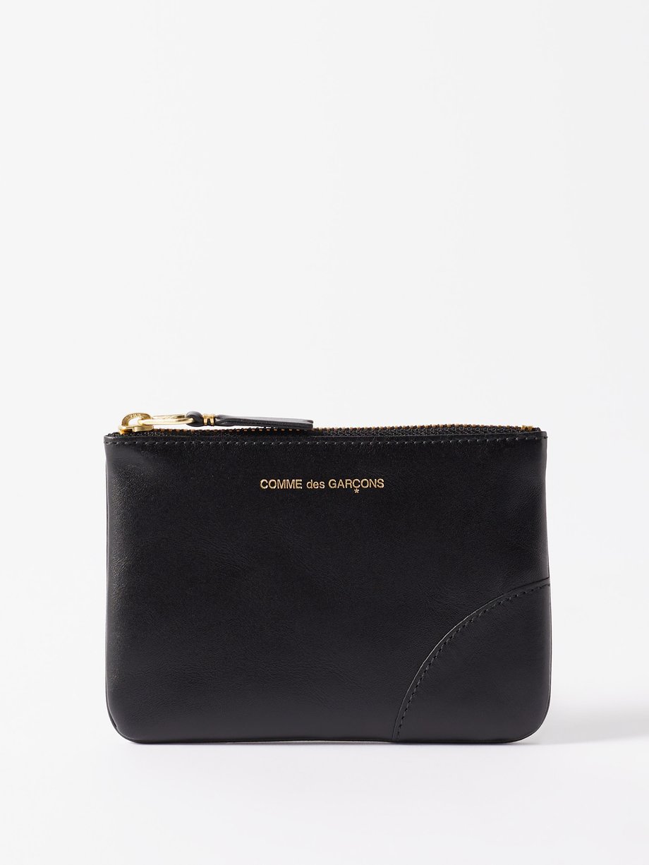 Black Zipped leather coin purse | Comme des Garçons Wallet | MATCHES UK