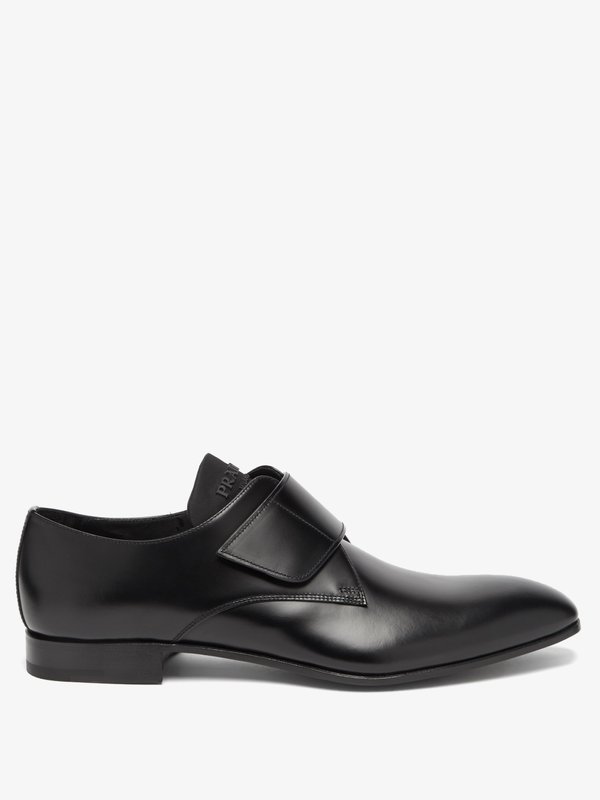 Black Logo-embossed and leather shoes | Prada | MATCHES UK