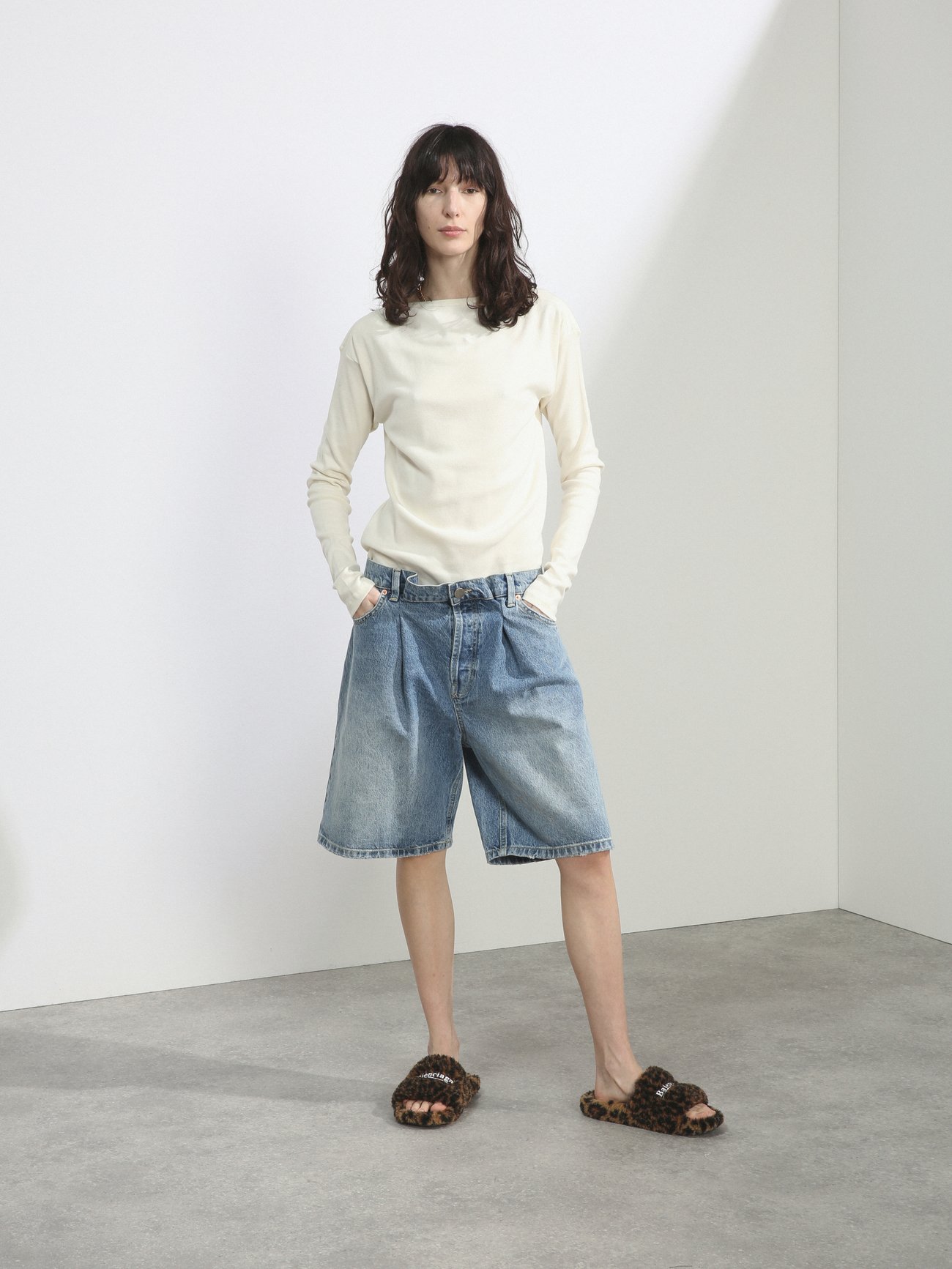 Raey’s blue shorts feature a mid-rise folded waistband, which is a hallmark code of the label’s androgynous aesthetic. They’re made from lightly faded cotton denim to a relaxed silhouette framed by yellow topstitching, with five pockets and wide legs finished with lightly distressed cuffs.