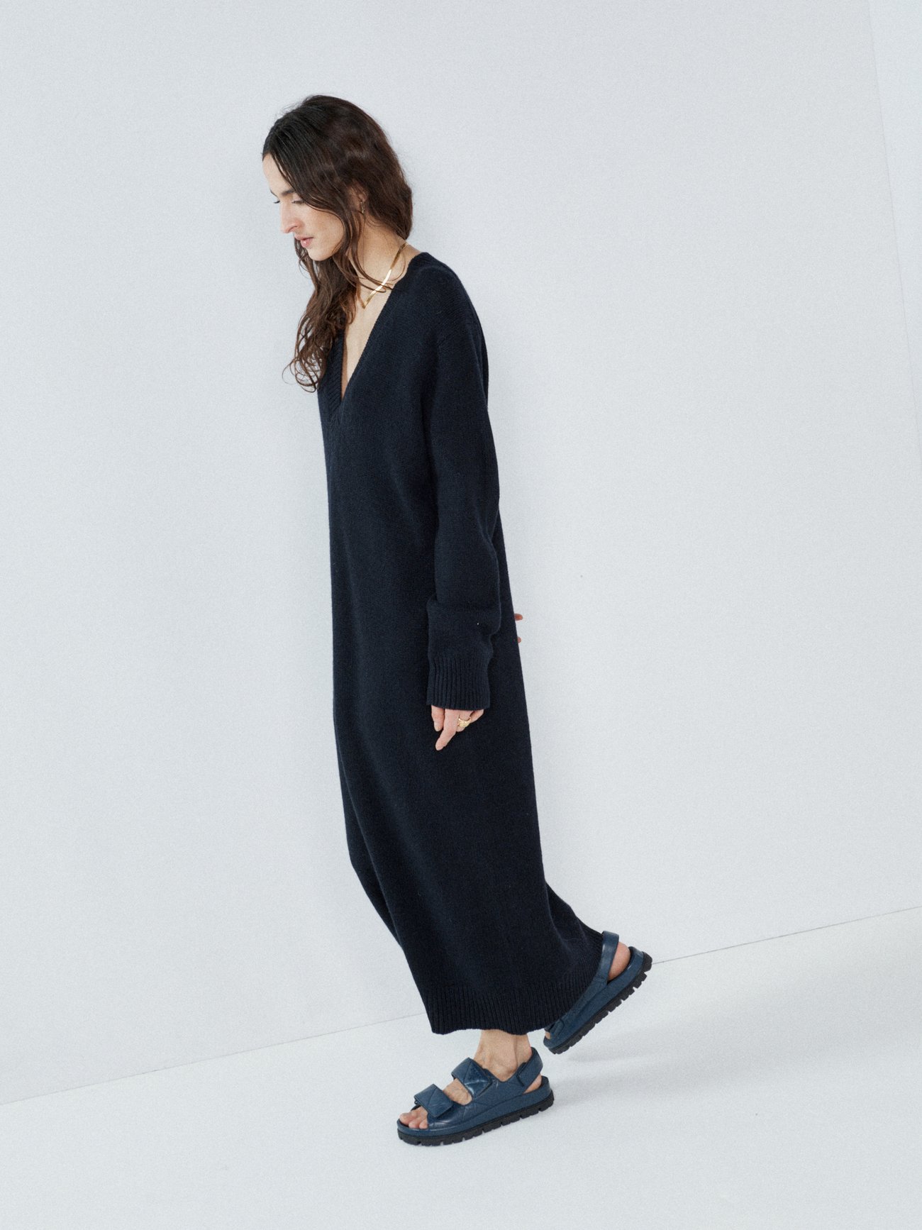 Spun from recycled cashmere and wool, Raey’s navy dress features a deep V-neckline, dropped shoulders and a floor-grazing length for a relaxed mood.