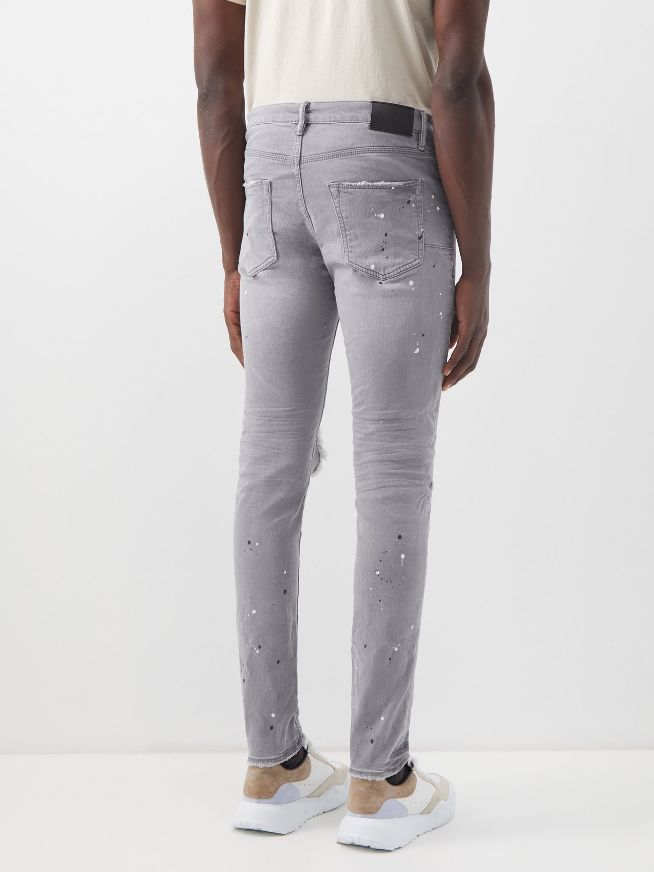 P001 distressed painted slim-leg jeans