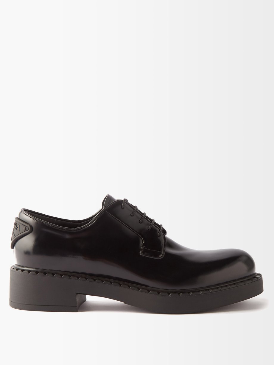 Black Triangle-logo leather Derby shoes | Prada | MATCHESFASHION UK