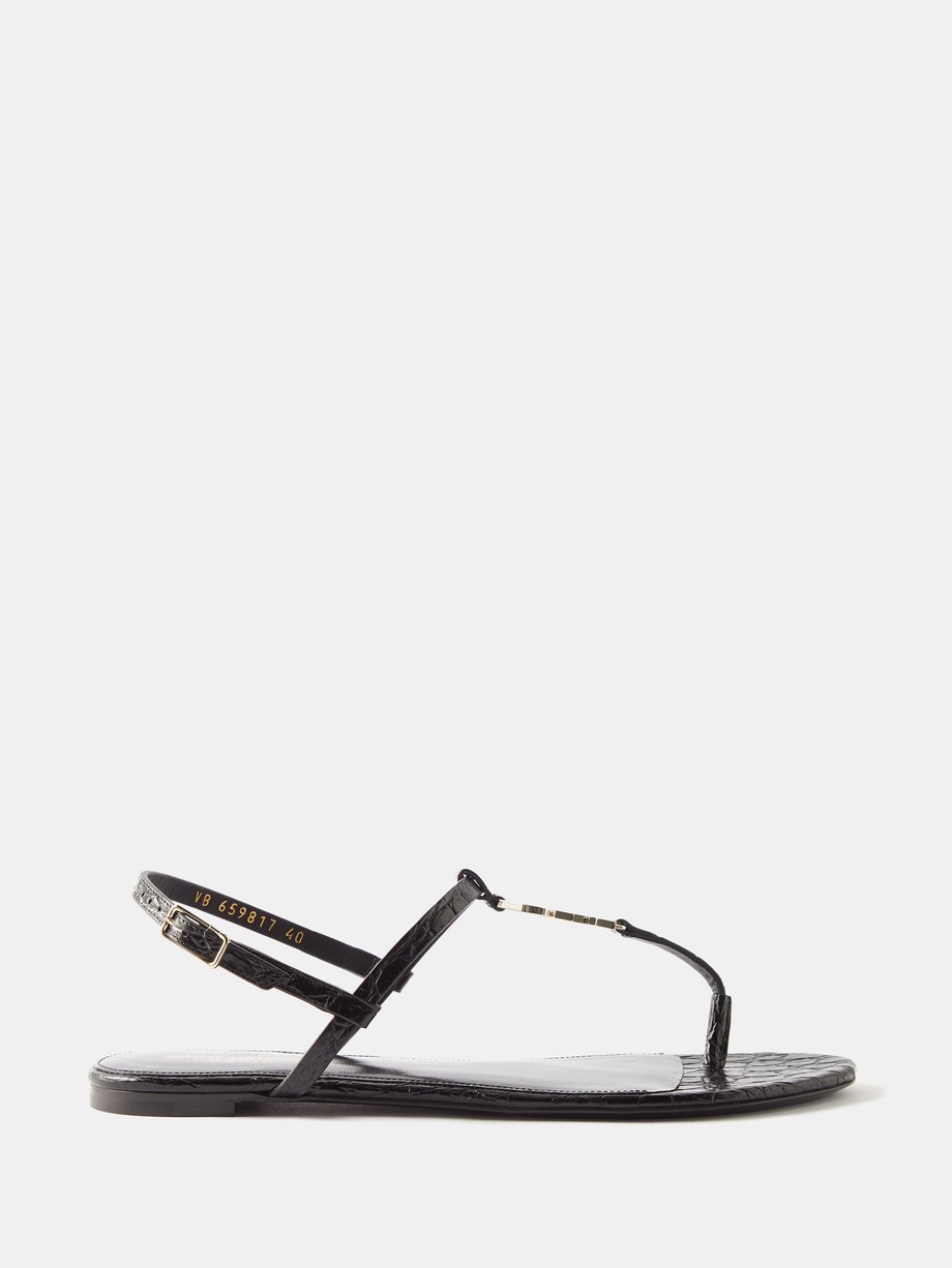 Black Cassandra YSL leather flat sandals | Saint Laurent ...