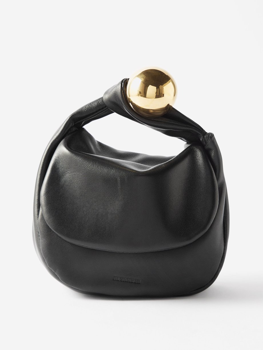 Black Embellished leather clutch bag | Jil Sander | MATCHESFASHION US
