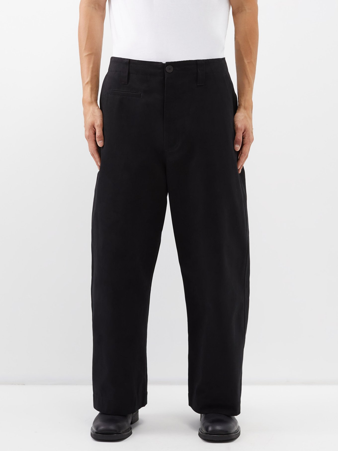 Black Tome pleated cotton-twill trousers | Studio Nicholson