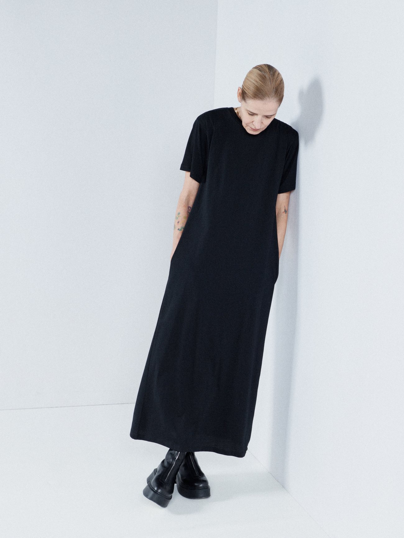 Wardrobe basics are given a relaxed feel by Raey showcased by this black T-shirt dress, made from a recycled cotton-blend jersey with dropped shoulders.