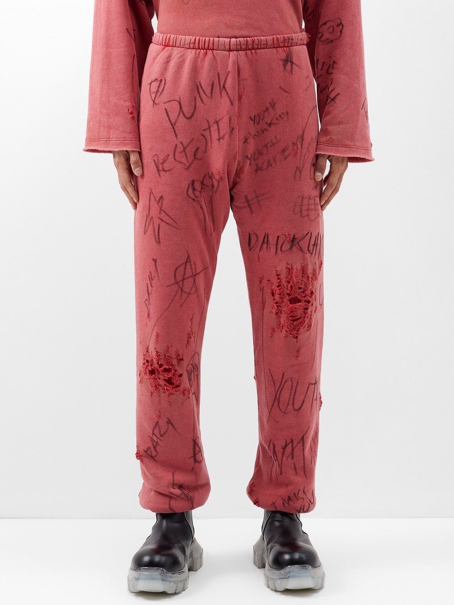 Red Juvenile distressed cotton-jersey track pants | Liberal Youth