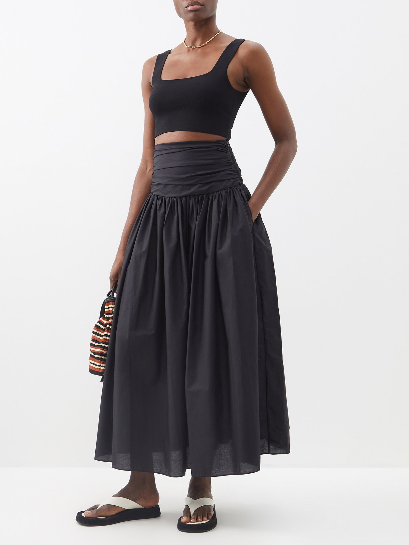 Matteau’s laid-back sensibility echoes throughout this black organic cotton maxi skirt, made in Australia. It has a defined high waist with ruching detail and fastens with a side zip. It has a fuller skirt and slide slip pockets. 