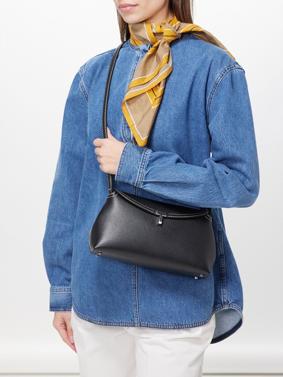 Black T-lock leather cross-body bag | Toteme | MATCHES UK
