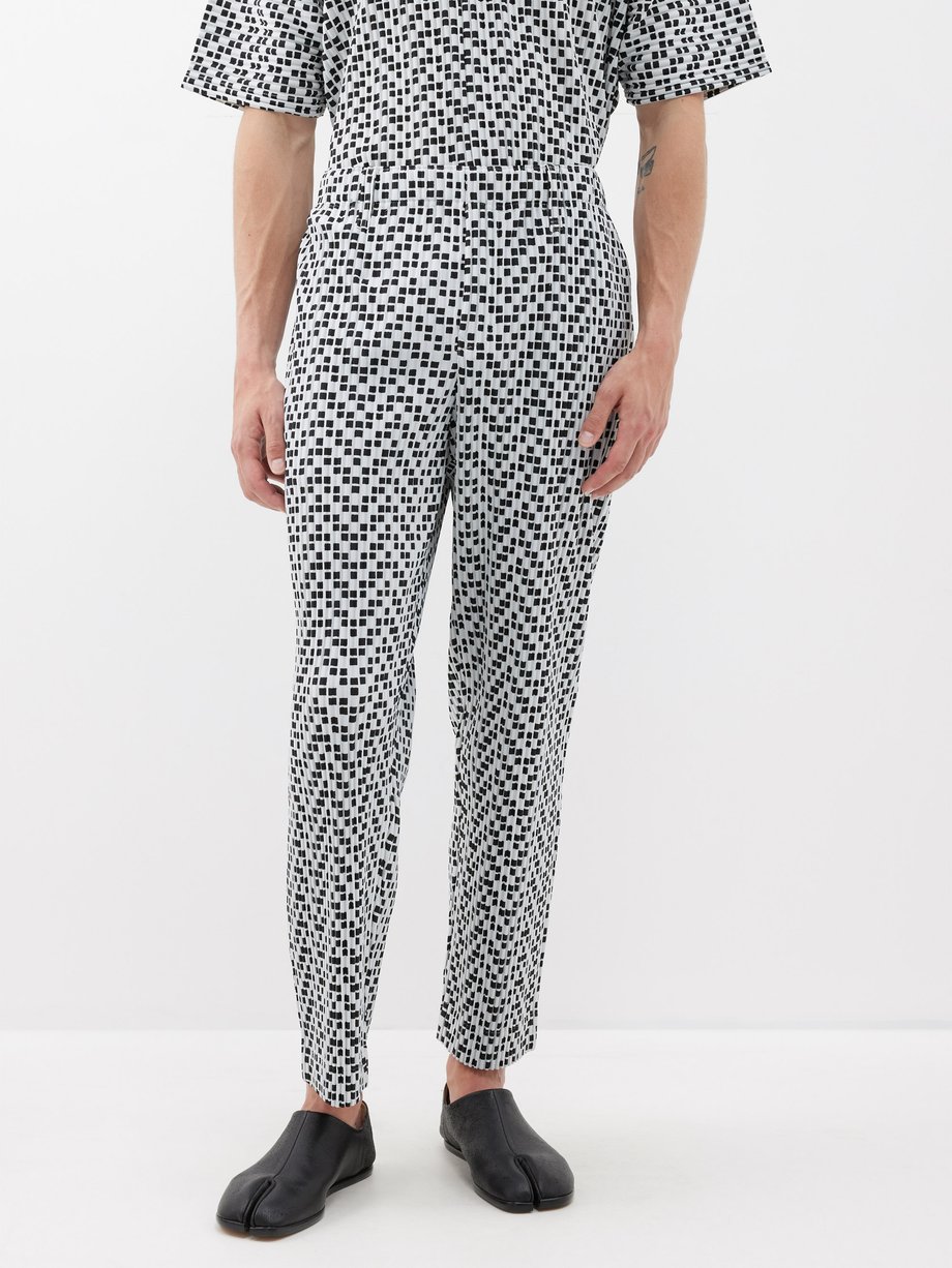 White Geometric-print technical-pleated trousers | Homme Plissé Issey ...