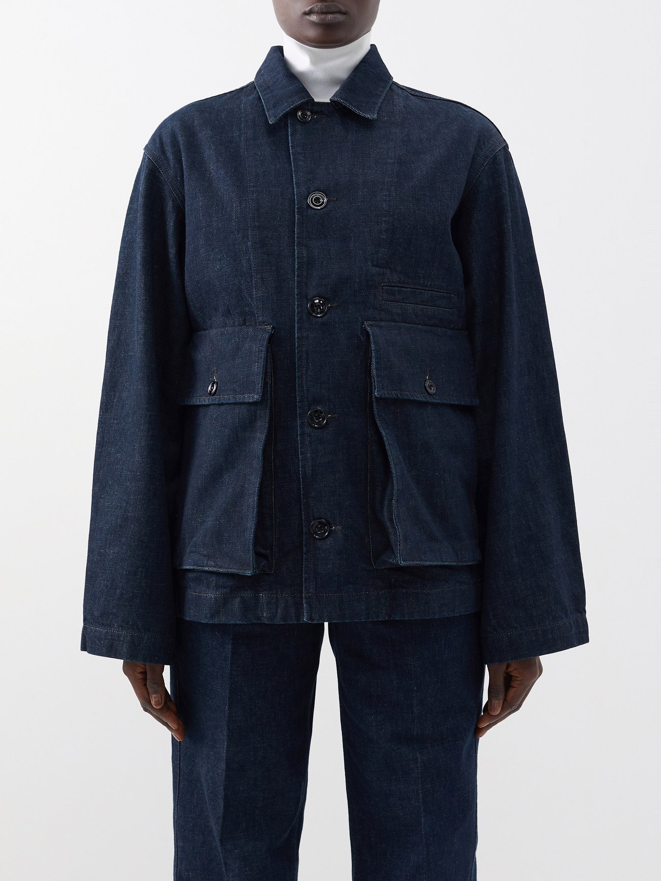Lemaire's playful approach to proportion is referenced in this navy jacket, cut from crisp denim and defined by oversized flap pockets and a boxy fit.