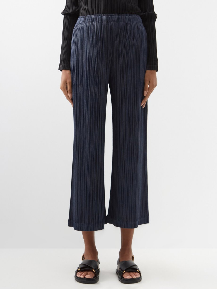 Homme Plissé Issey Miyake Ribbed Tapered Trousers  Farfetch
