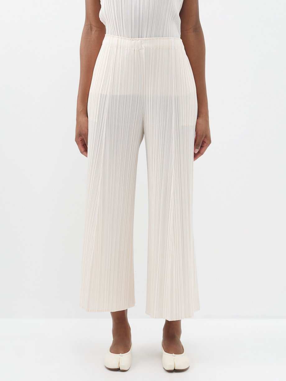 Pink Cropped technical-pleated trousers | Pleats Please Issey Miyake ...
