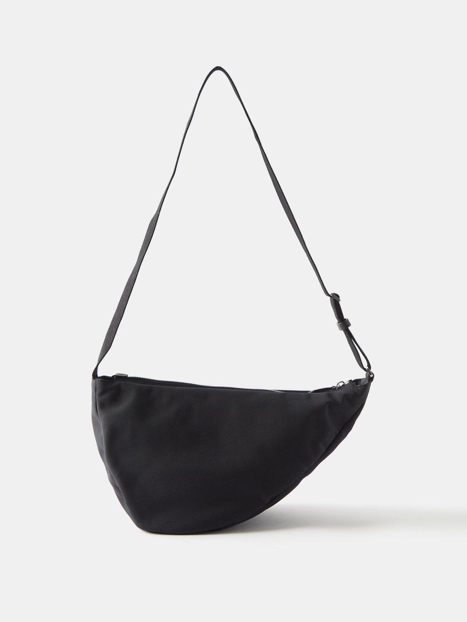 더 로우 블랙 Slouchy Banana coated-canvas cross-body bag | 매치스패션, 모던 럭셔리 온라인 쇼핑