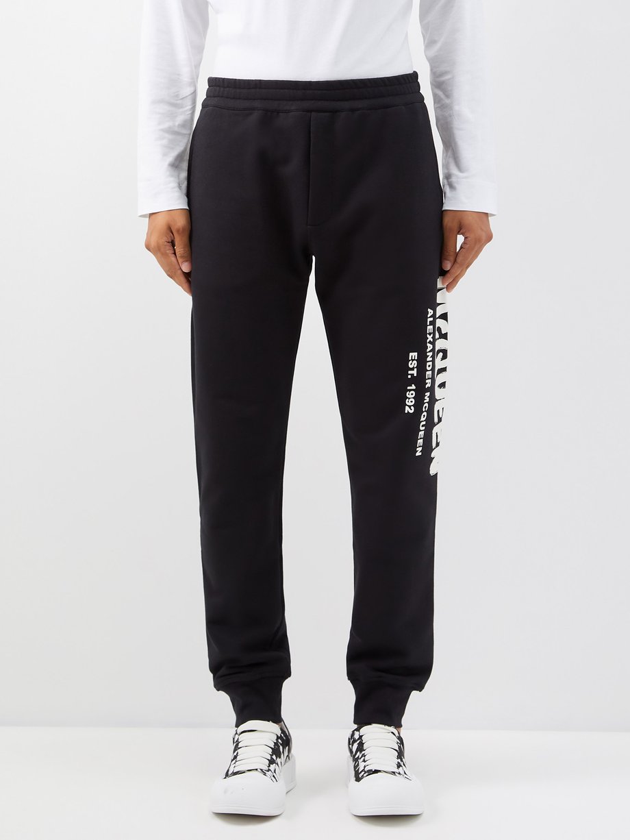 Black Graffiti-logo cotton-jersey track pants | Alexander McQueen ...