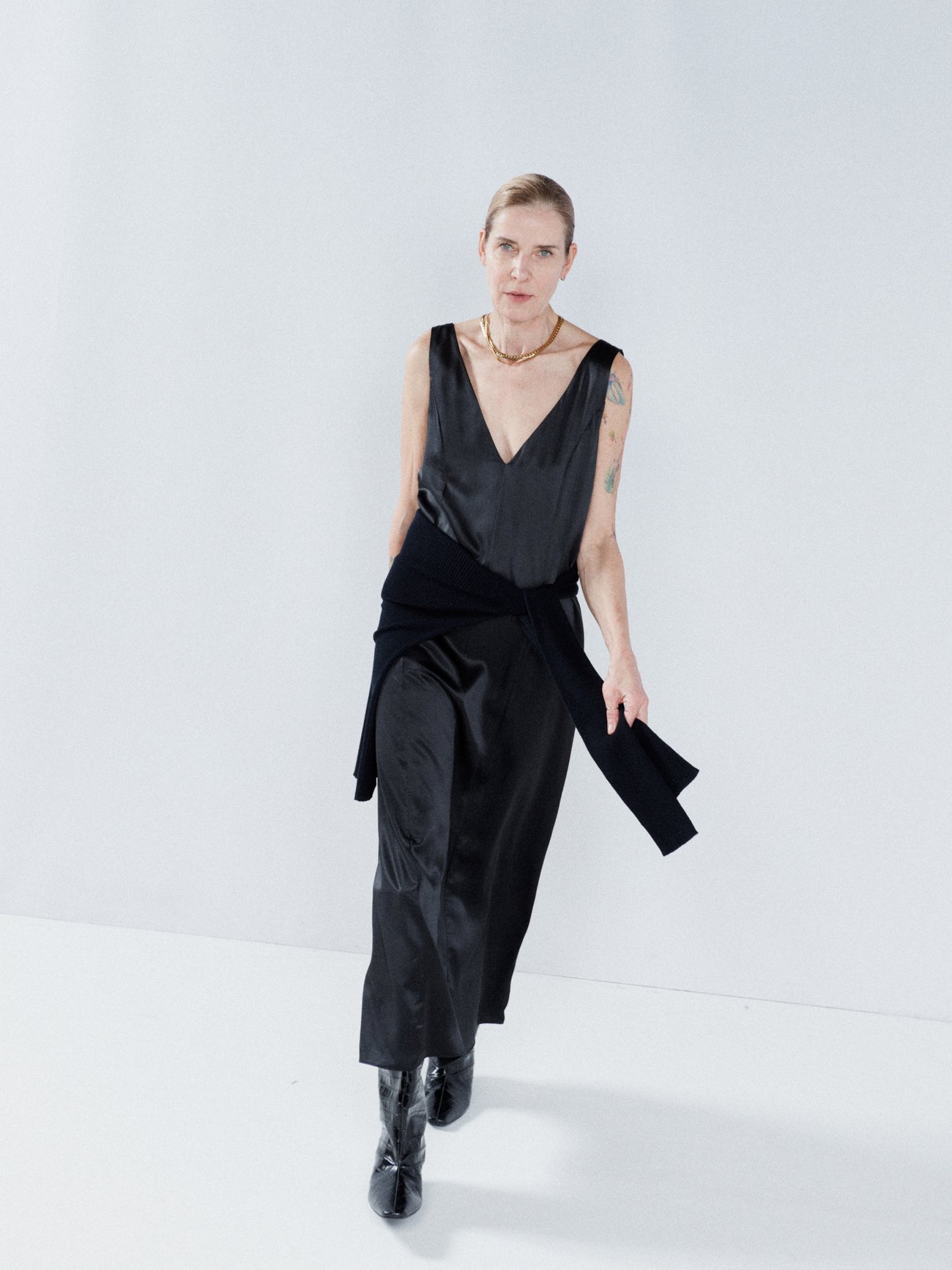 Raey produces minimalistic wardrobe staples such as this black oversized slip dress, constructed from panels of lightweight silk satin with a fluid drape.