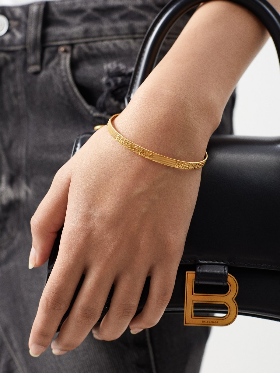 Gold Force embossed-logo bracelet | Balenciaga | MATCHES UK