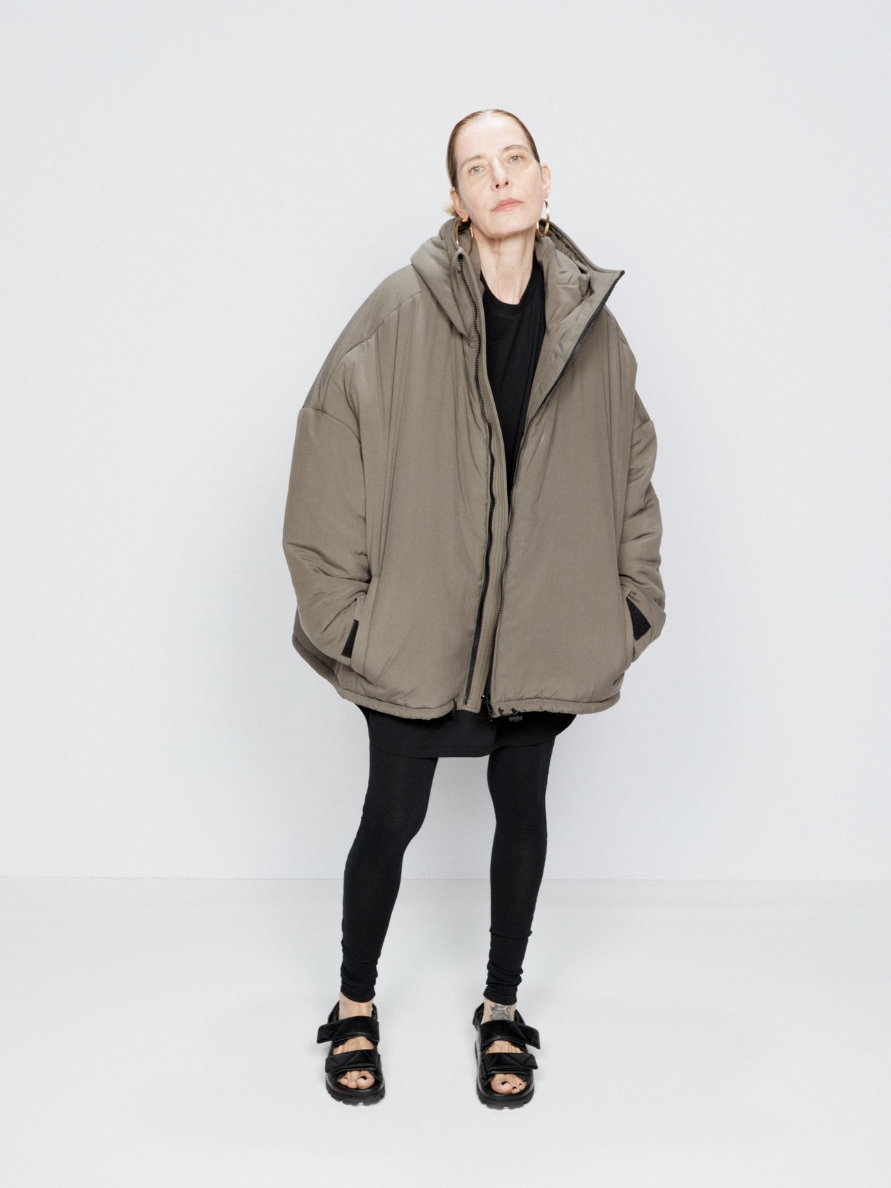 8 types of coats that never go out of style. Made from padded matte silk, Raey's khaki-green jacket has velcro cuffs, a generous hood and a black front zip.