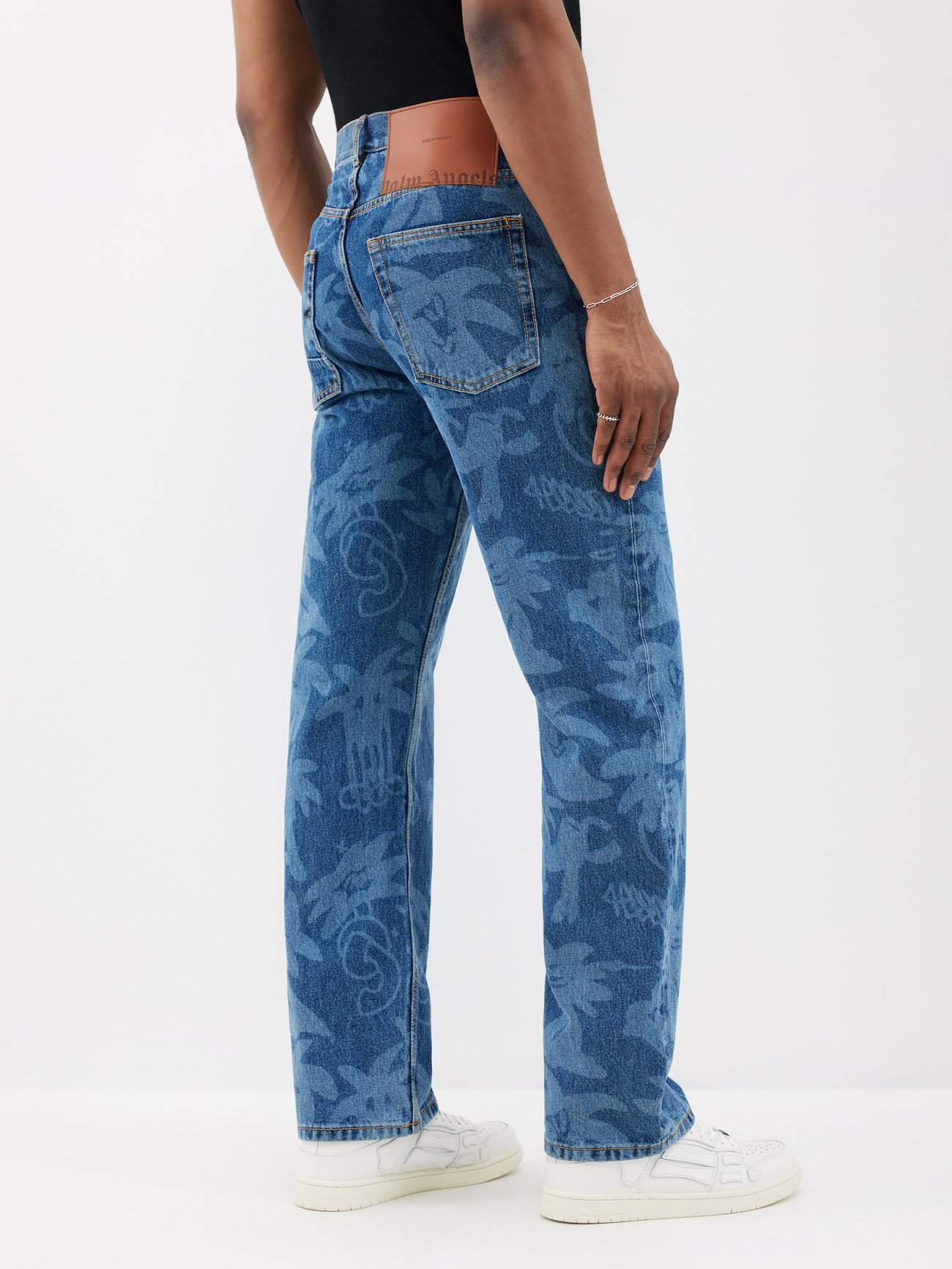 Blue Palmity-print denim jeans | Palm Angels | MATCHES UK