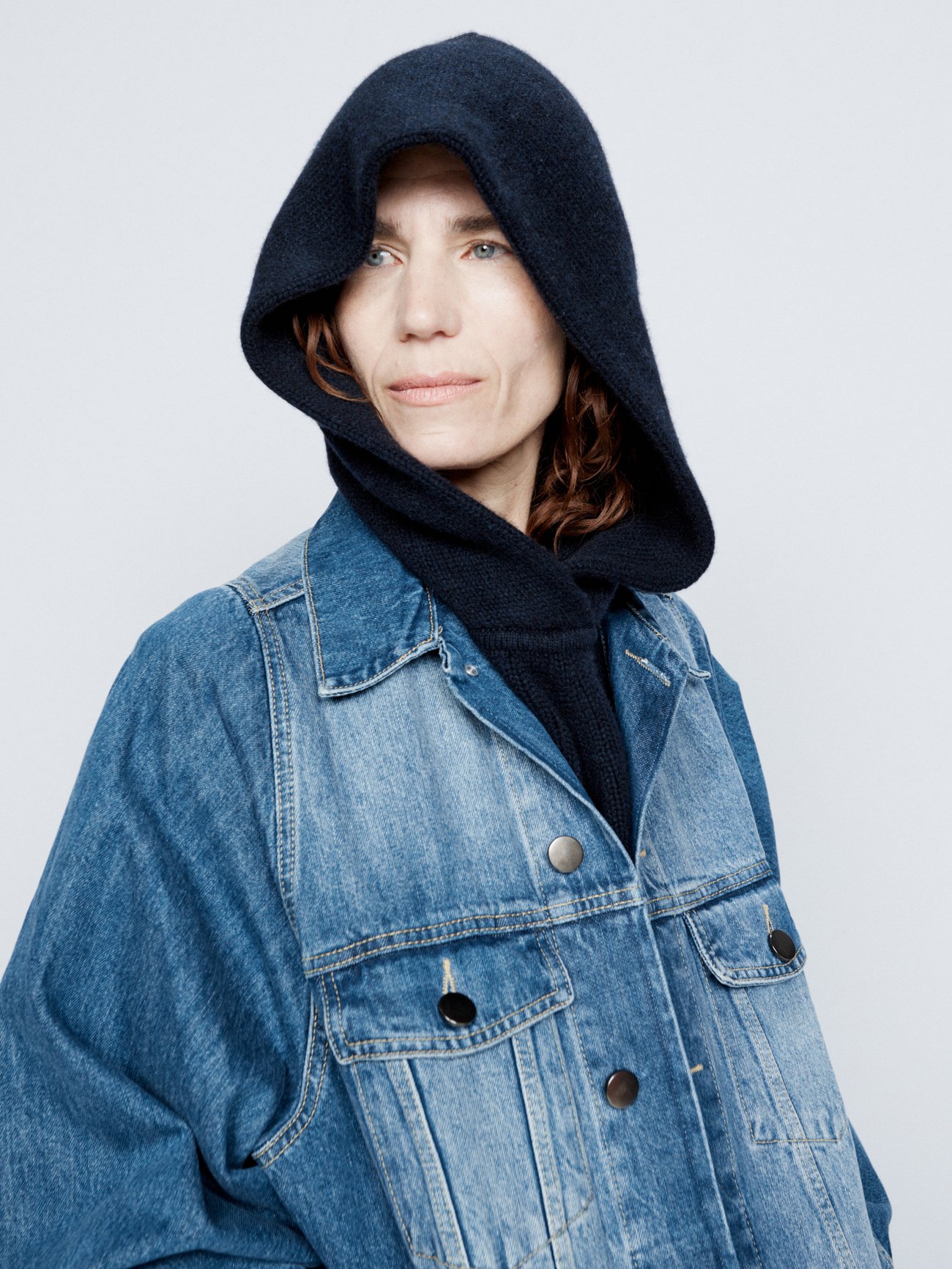 Raey's navy hood is knitted from impeccably soft GOTS-certified cashmere with an extended hem designed to be layered under outerwear.