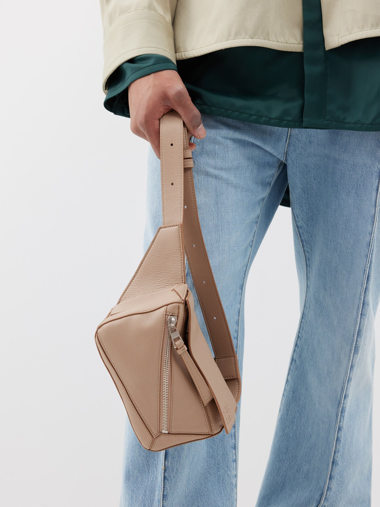 Puzzle Edge mini leather cross body bag