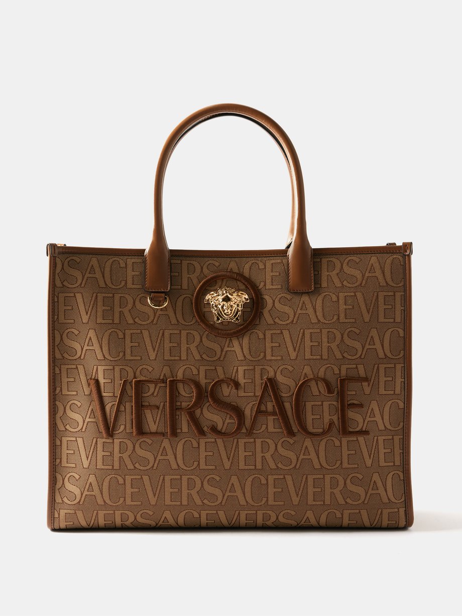 Beige Logo-jacquard canvas shoulder bag | Versace | MATCHESFASHION UK