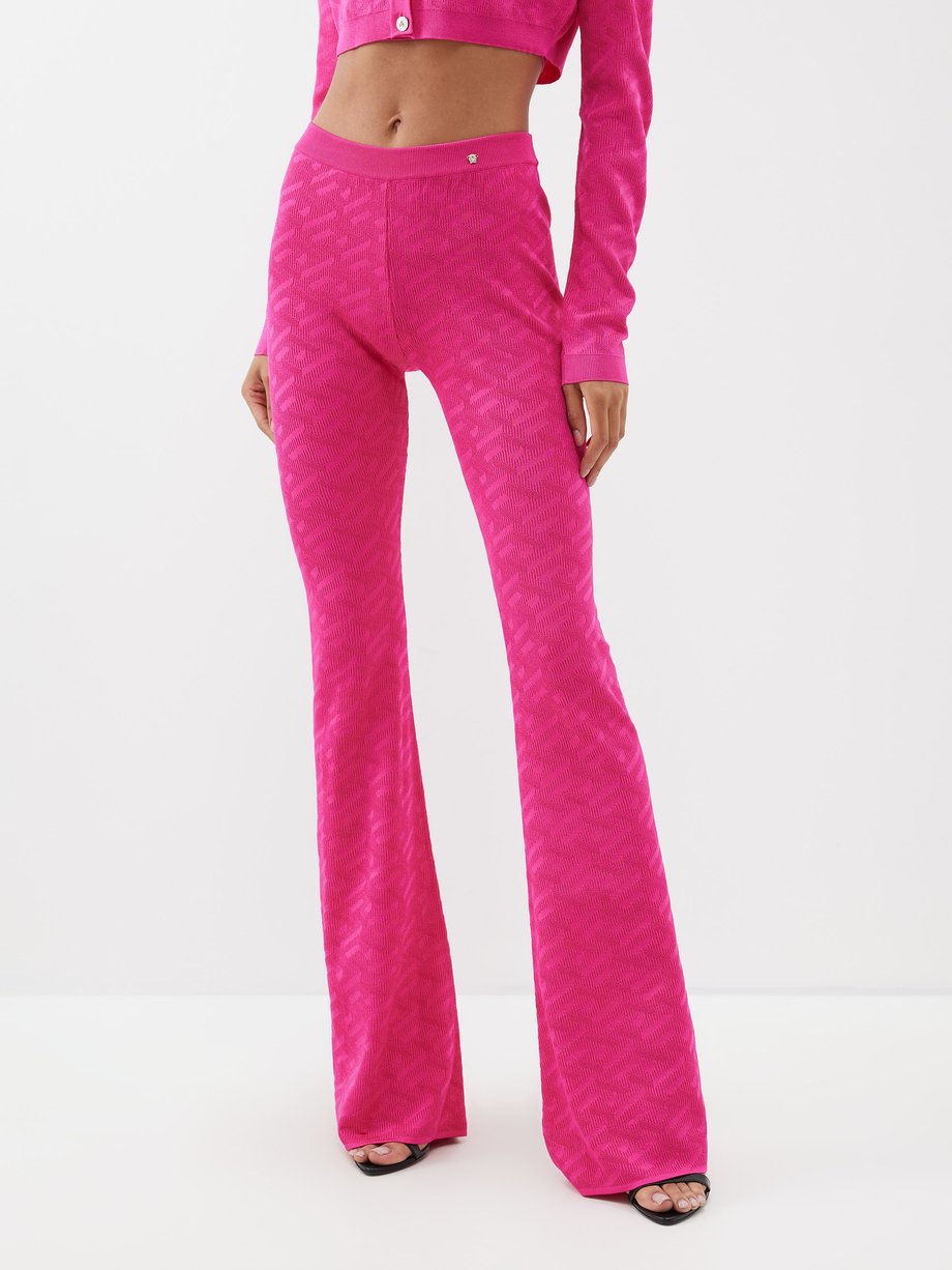 Pink Logo-jacquard knit flared trousers | Versace | MATCHESFASHION US