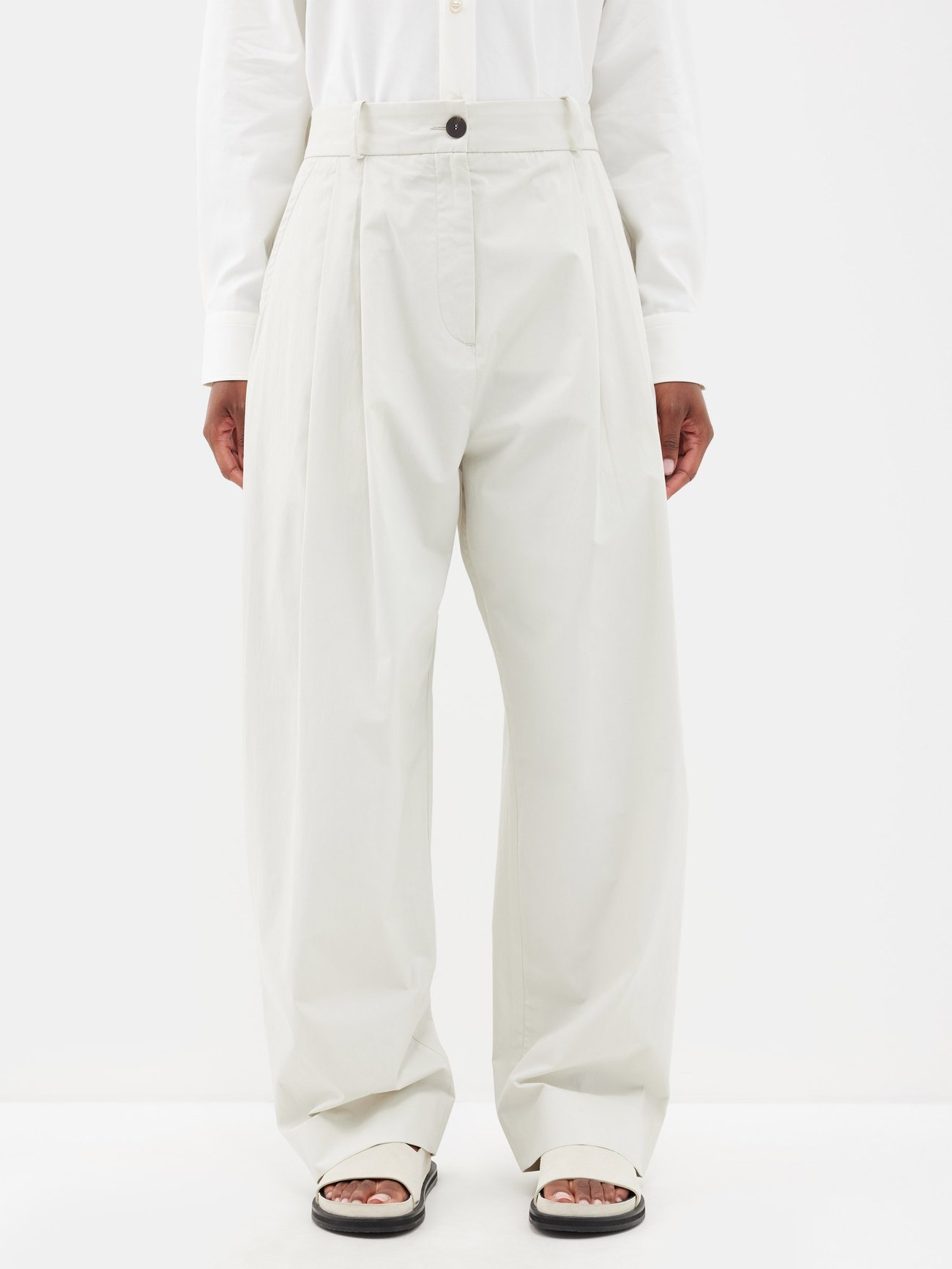 White Acuna pleated cotton trousers | Studio Nicholson | MATCHESFASHION UK