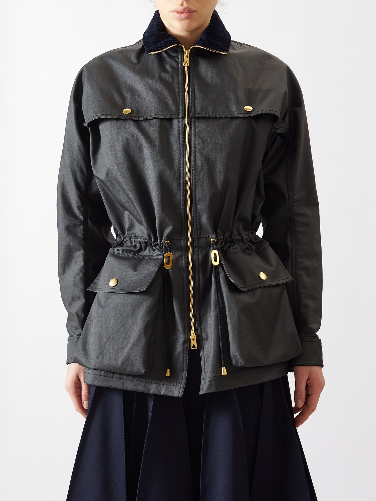 Trending Winter Coats 2023 2024 - Bottega Veneta’s adds a utilitarian flair through the generous flap pockets of this black parka – cinch the waist with the drawstrings for a personalised fit.