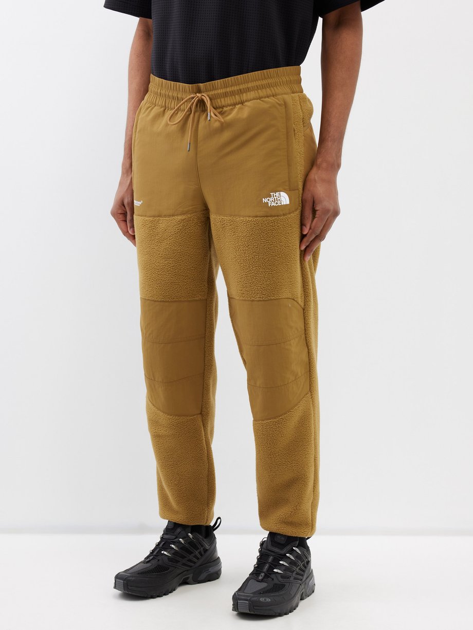 Yellow Denali fleece and shell track pants | The North Face | MATCHES UK