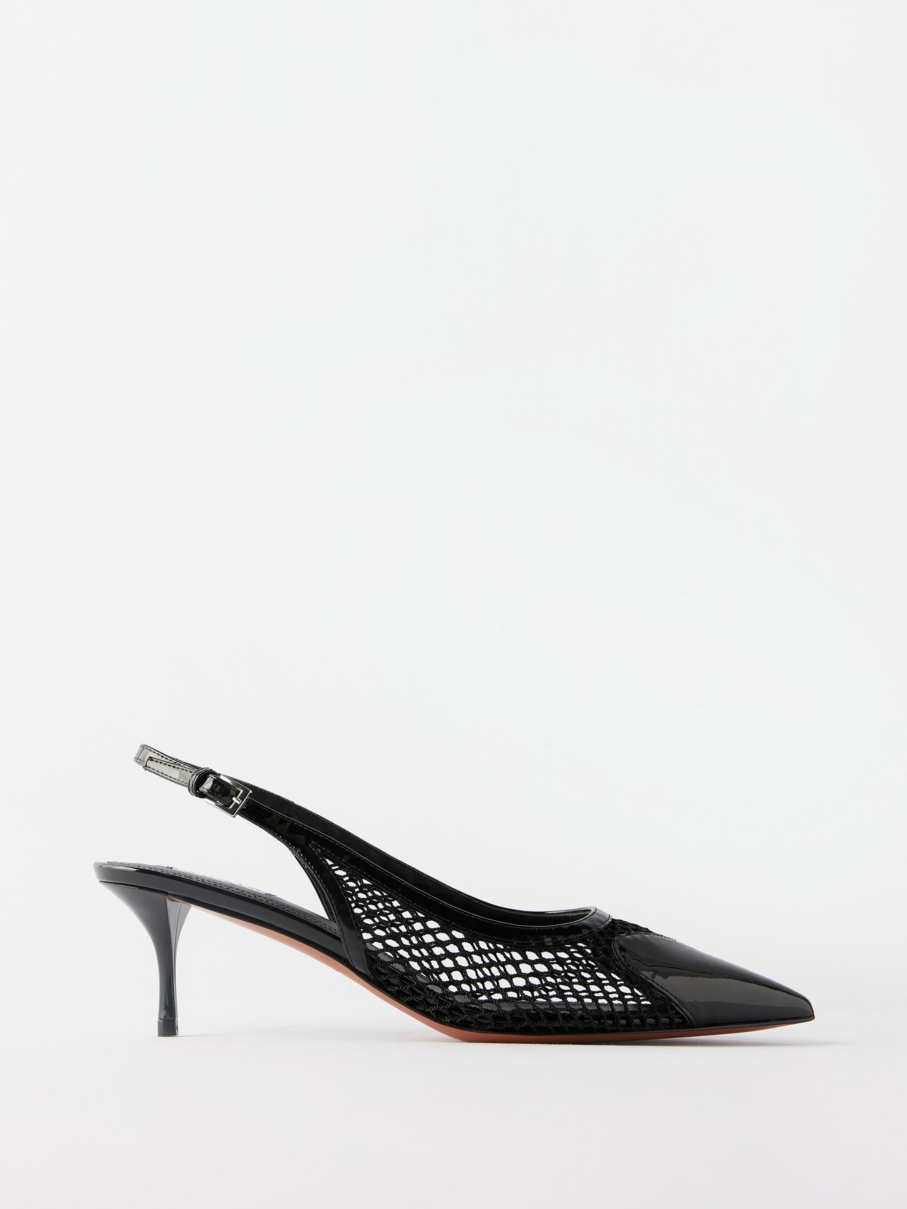 Tap into ALAÏA's alluring aesthetic with these black Heart slingback pumps, expertly crafted in Italy to a mesh construction with a patent leather trim.