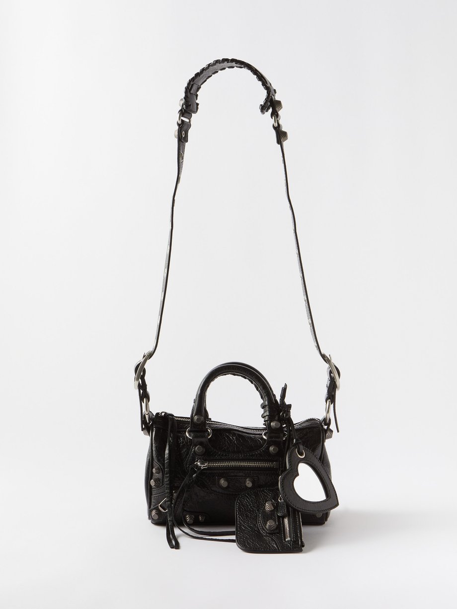Black Le Cagole mini leather cross-body duffle bag | Balenciaga ...
