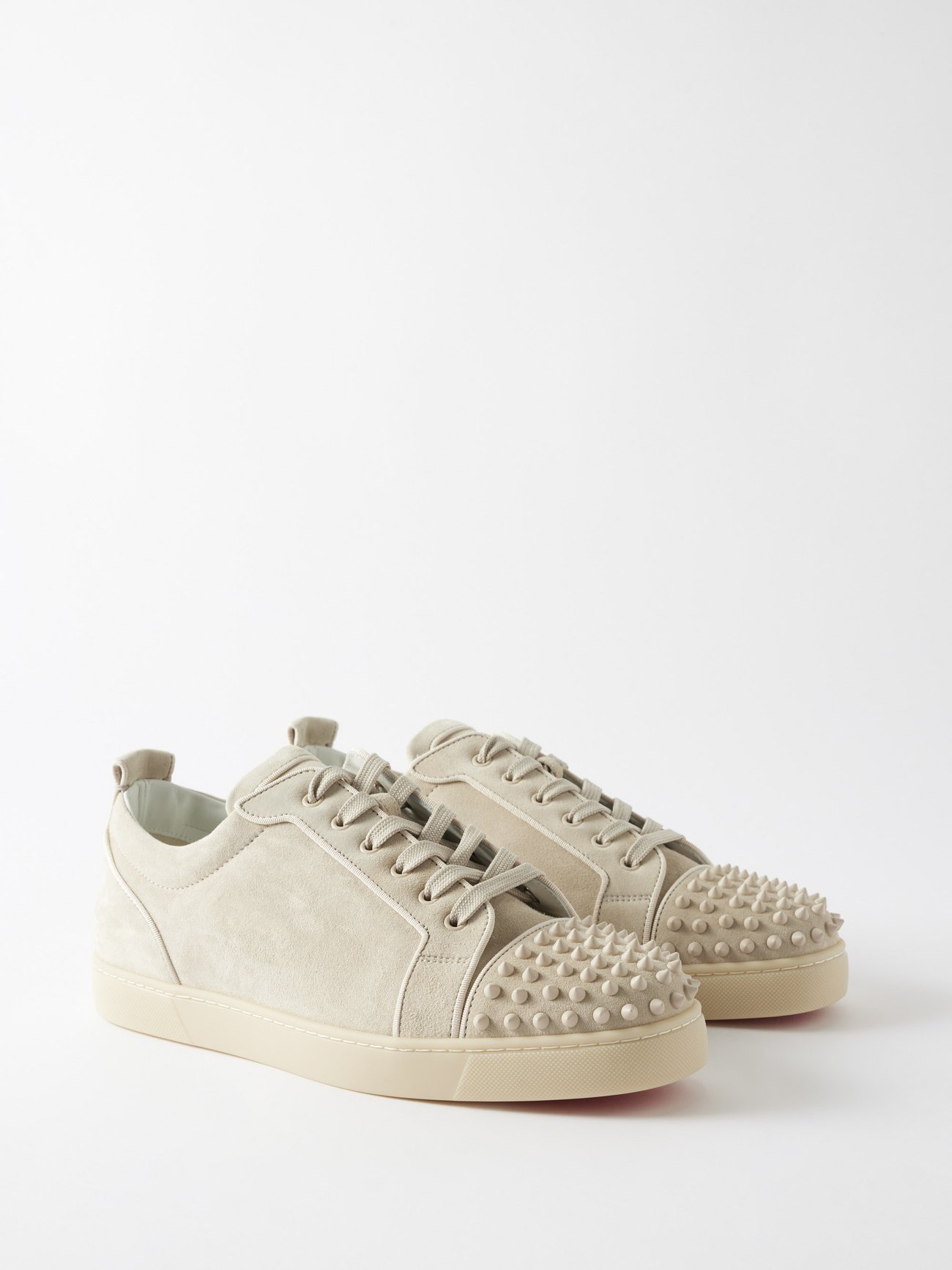 CHRISTIAN LOUBOUTIN WHITE LOUIS JUNIOR SPIKE FLAT CALF LOW SNEAKER ON FOOT  