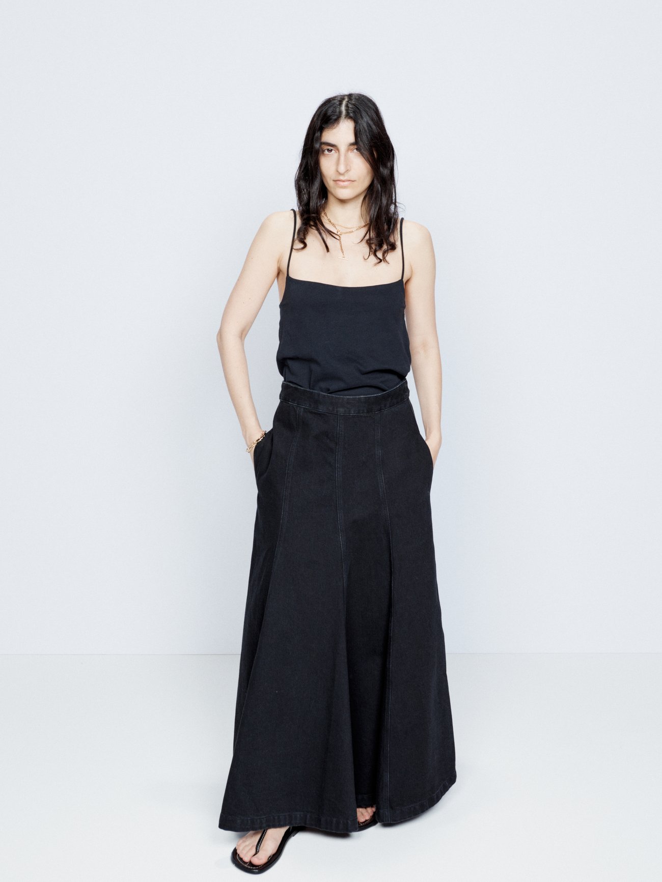 Raey’s black denim skirt is crafted from organic cotton to a long maxi length with a panelled construction.