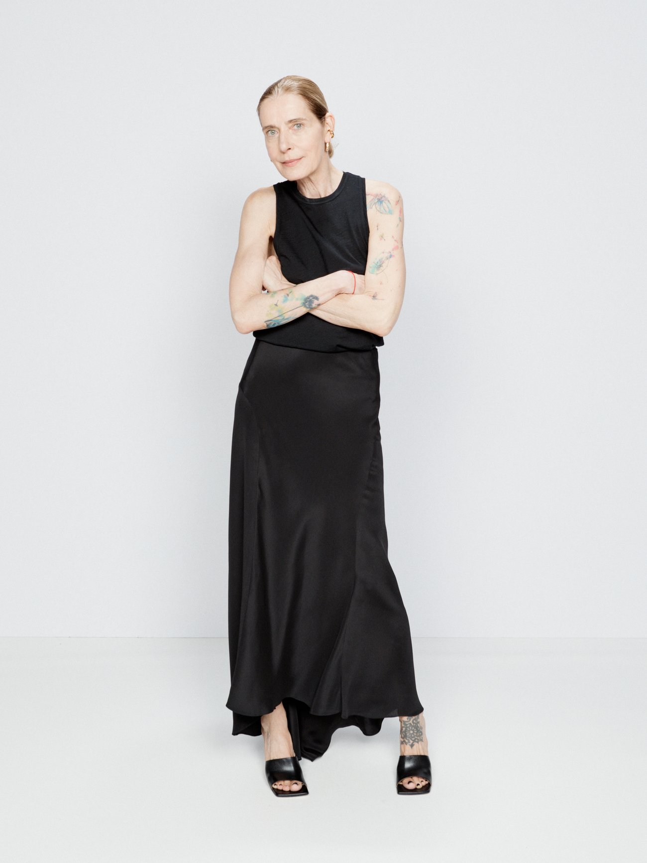 Raey’s black maxi slip skirt is made in the UK from double-faced silk satin with a draping fishtail hem and a concealed zip fastening.