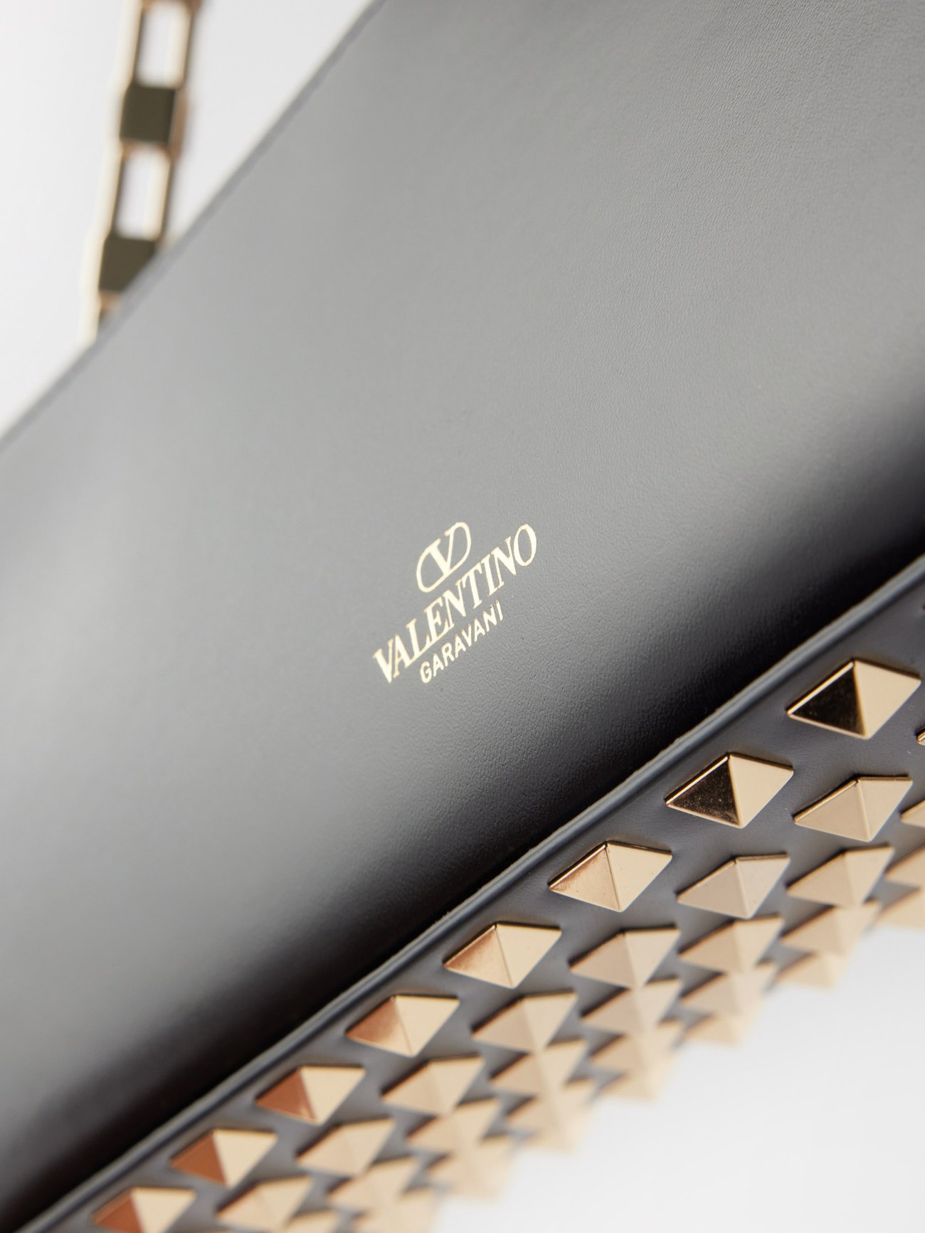 Valentino Garavani Men's Rockstud Black Leather Clutch Bag Wrist Strap –  AvaMaria