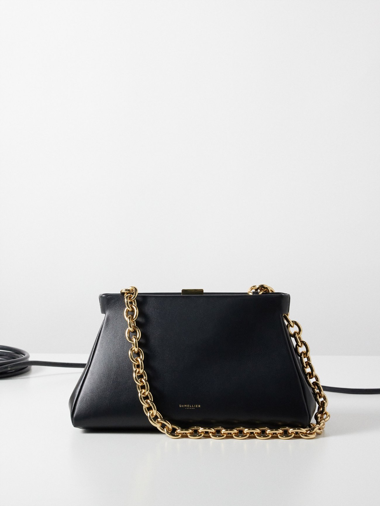 Black Cannes leather clutch bag | DeMellier | MATCHES UK