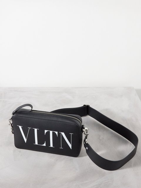 Black VLTN leather cross-body bag | Valentino Garavani | MATCHES UK