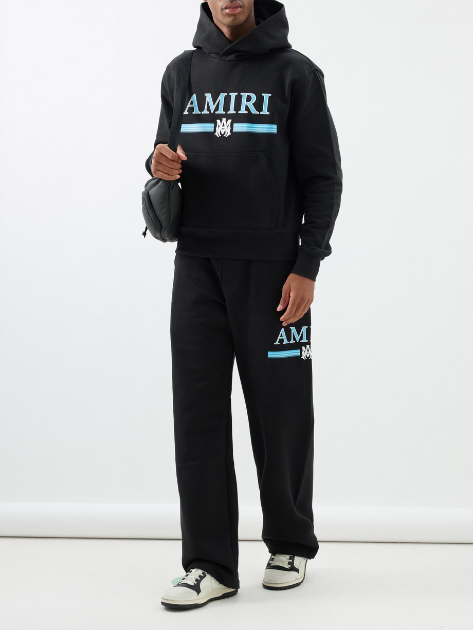 Black Logo-print cotton-jersey track pants | Amiri | MATCHES UK
