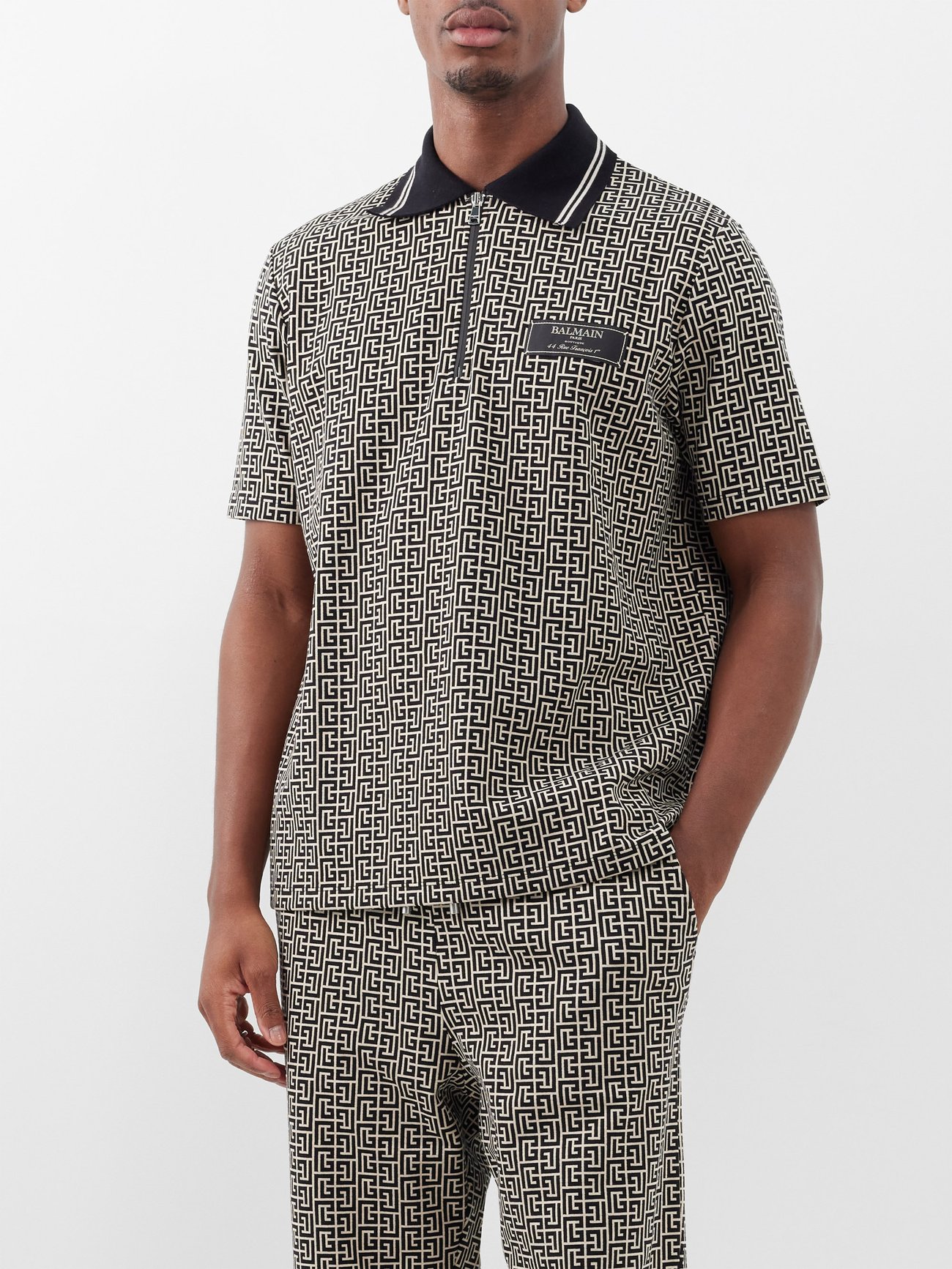 Black Monogram-jacquard cotton-blend polo shirt | Balmain | MATCHES UK