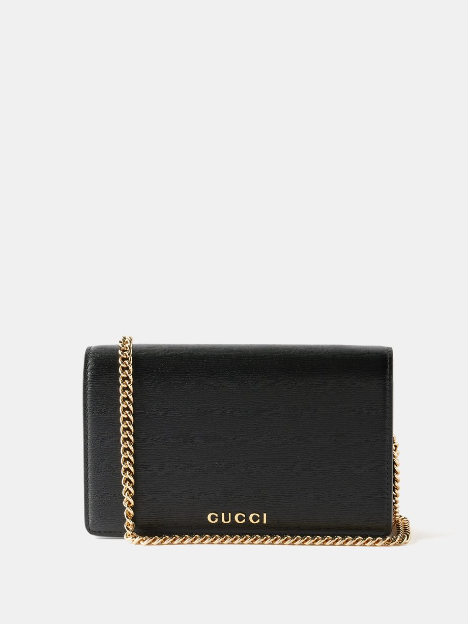 Black Gucci-script leather cross-body bag | Gucci | MATCHES UK