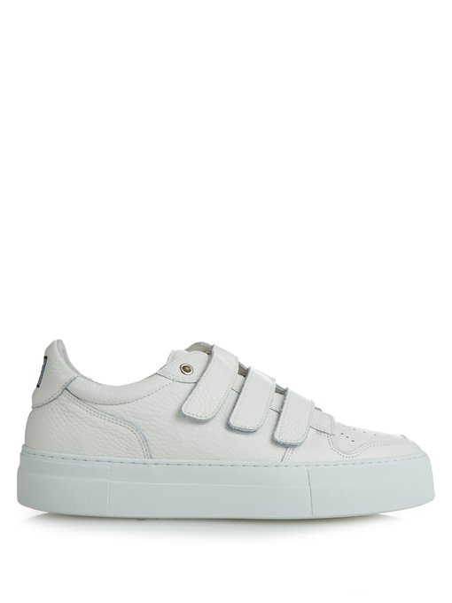 white trainers with velcro fastening