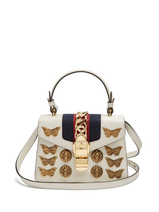 white gucci bag with butterfly