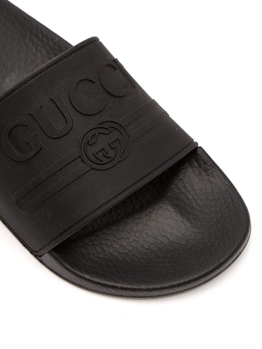 Logo-embossed rubber slides | Gucci 