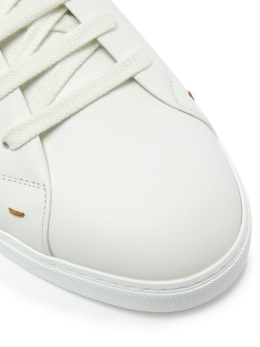 white embroidered trainers