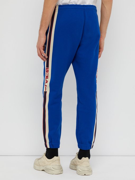 gucci pants with stripe down the side