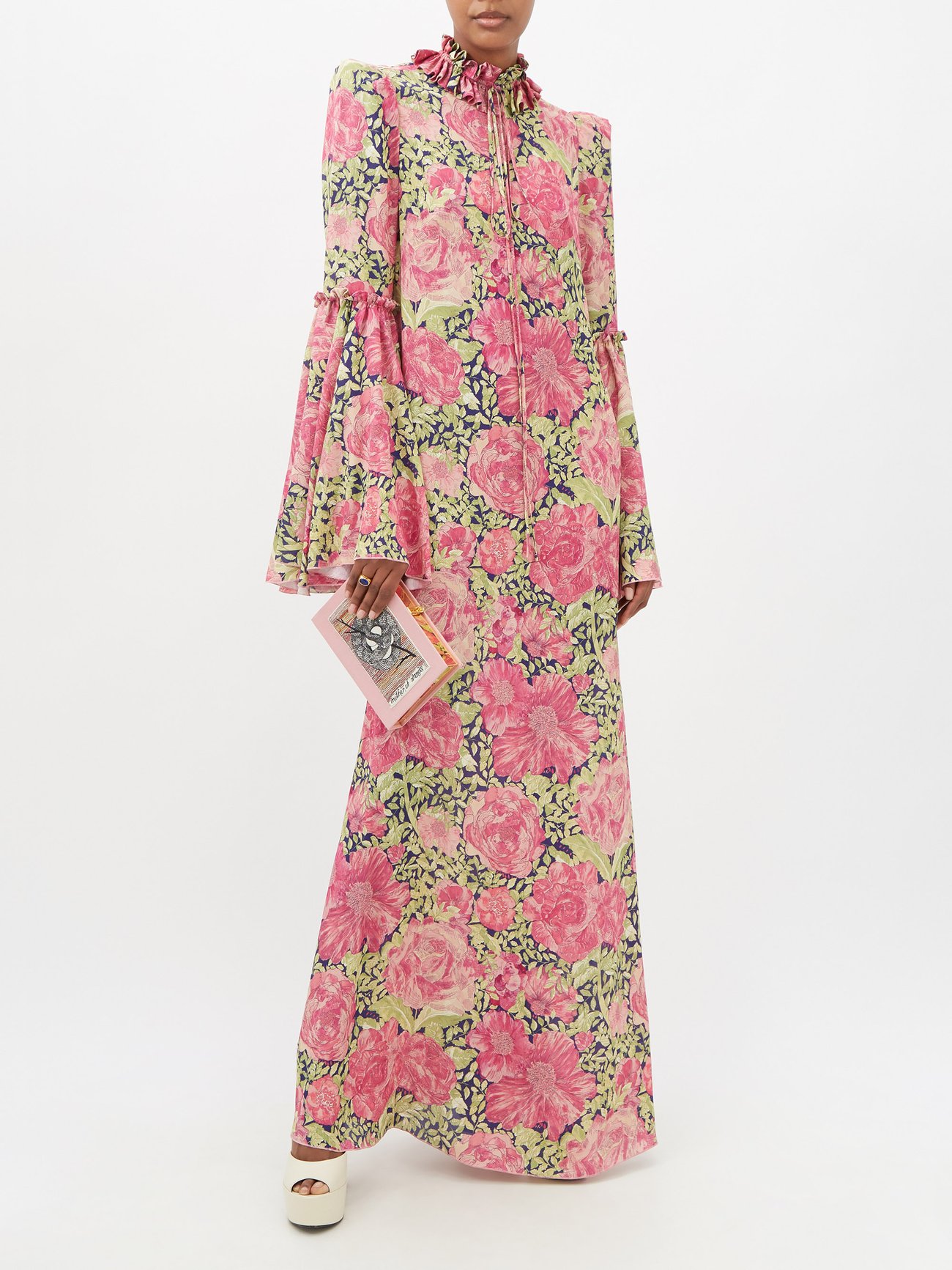 The Vampire's Wife's pink floral maxi dress is made from crepe patterned with blooming roses and shaped with a ruffled high neck, alongside long loose flared sleeves.