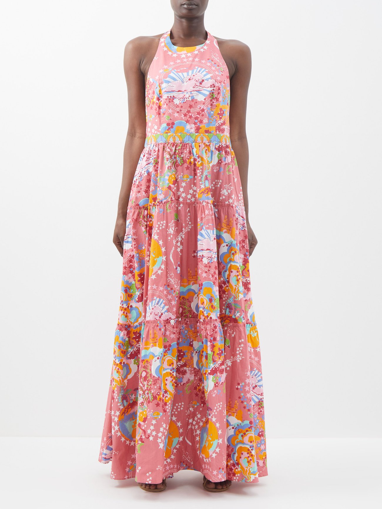 Emporio Sirenuse's pink Isotta dress is crafted from lightweight cotton voile that is hand-printed with the label's whimsical Caliph's dream pattern. It is maxi in length with a full skirt, fitted bodice, and round halter neck that ties at the back and reveals the back.